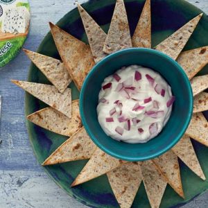 Tortilla chips with blue cheese and red onion dip